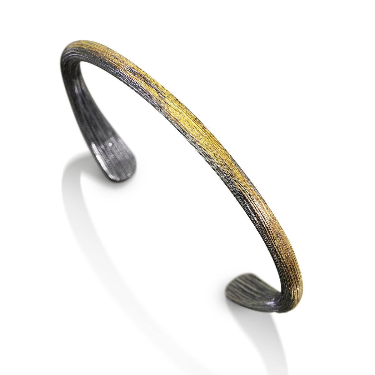 Woodland Bar Cuff in oxidized sterling silver with 18k gold inlay by Jacob Keleher
